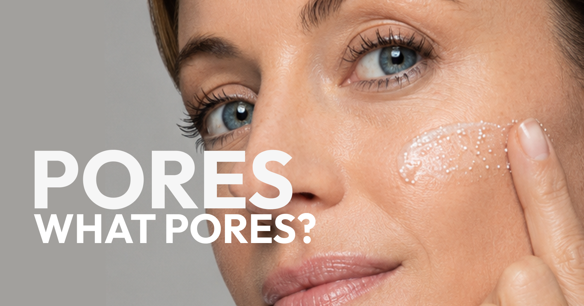 Woman applying skincare to cheek to target the appearance of enlarged pores for smoother-looking skin
