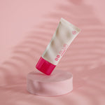 freezeframe BB BLUR product tube on pedestal with pink background 