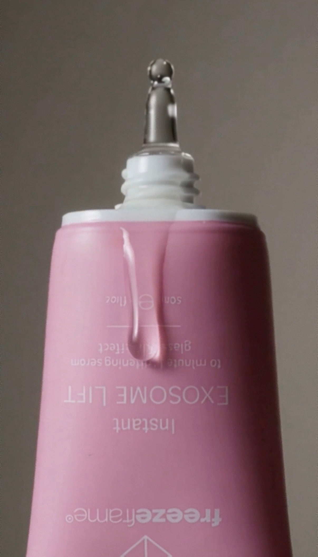 freezeframe Instant EXOSOME LIFT close-up on product dispenser showing clear gel texture