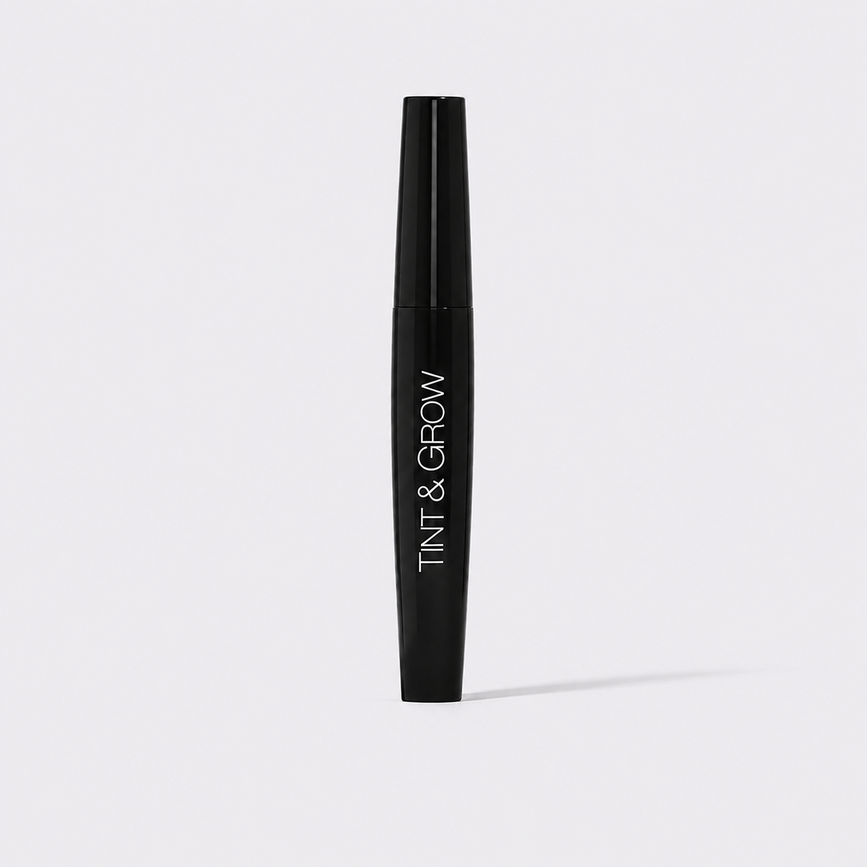 Freezeframe Tint & Grow lash tint and lash growth serum in a black tube for darker, longer-looking lashes.