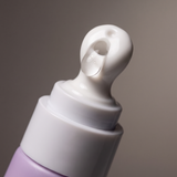 Close-up of freezeframe non-surgical EYELID LIFT cooling ceramic massage head with upper eyelid lifting serum