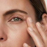 freezeframe non-surgical EYELID LIFT clear serum gel texture applied to upper eyelid by woman 